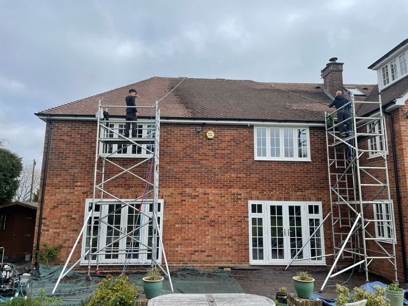 Roof cleaning carried out safely from scaffold towers by The Roof Moss Cleaners in Littleport